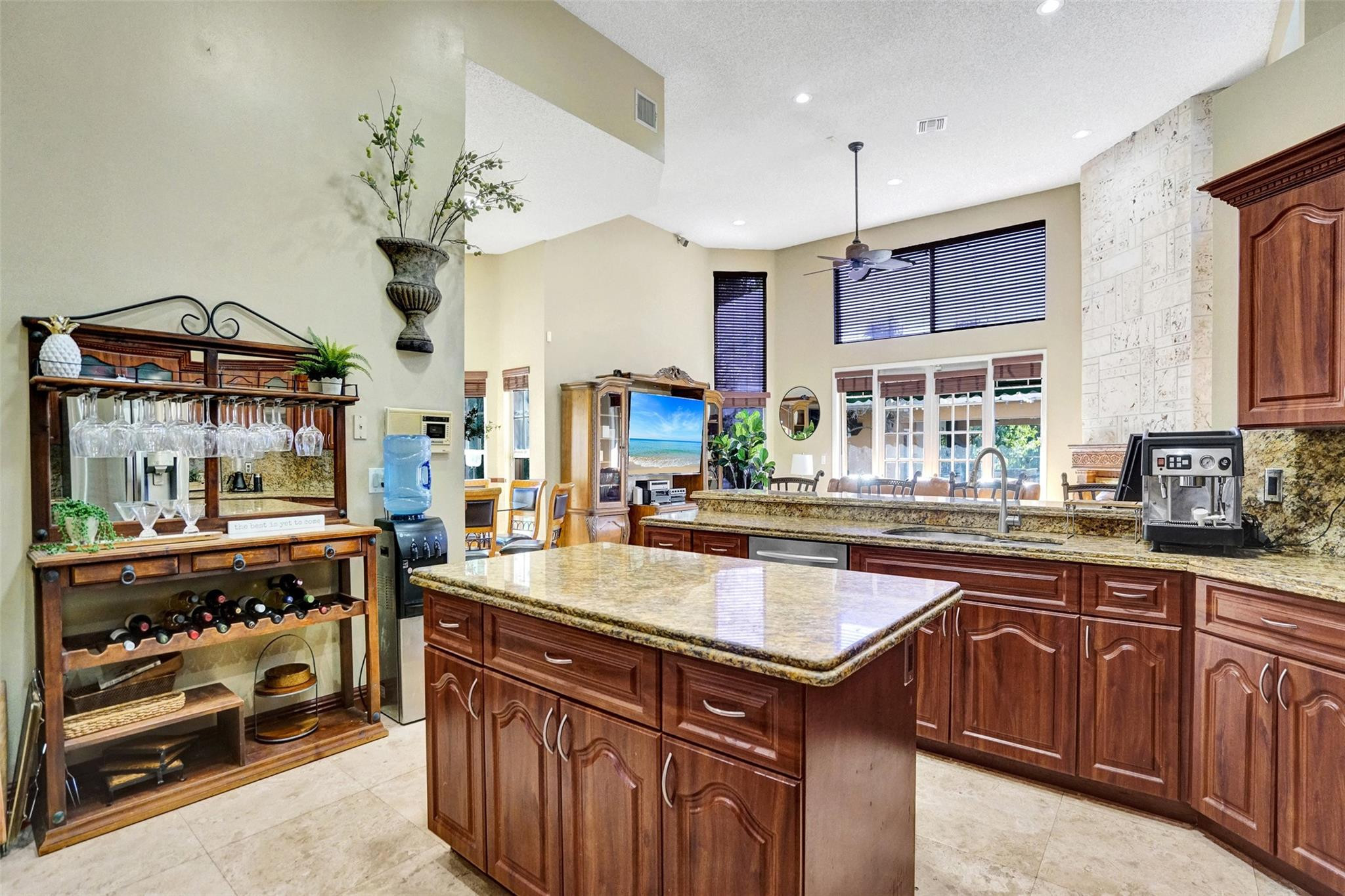 3151 Southwest 135th Terrace Davie, FL 33330 - Photo 18 of 74 a kitchen with stainless steel appliances granite countertop a sink and a stove