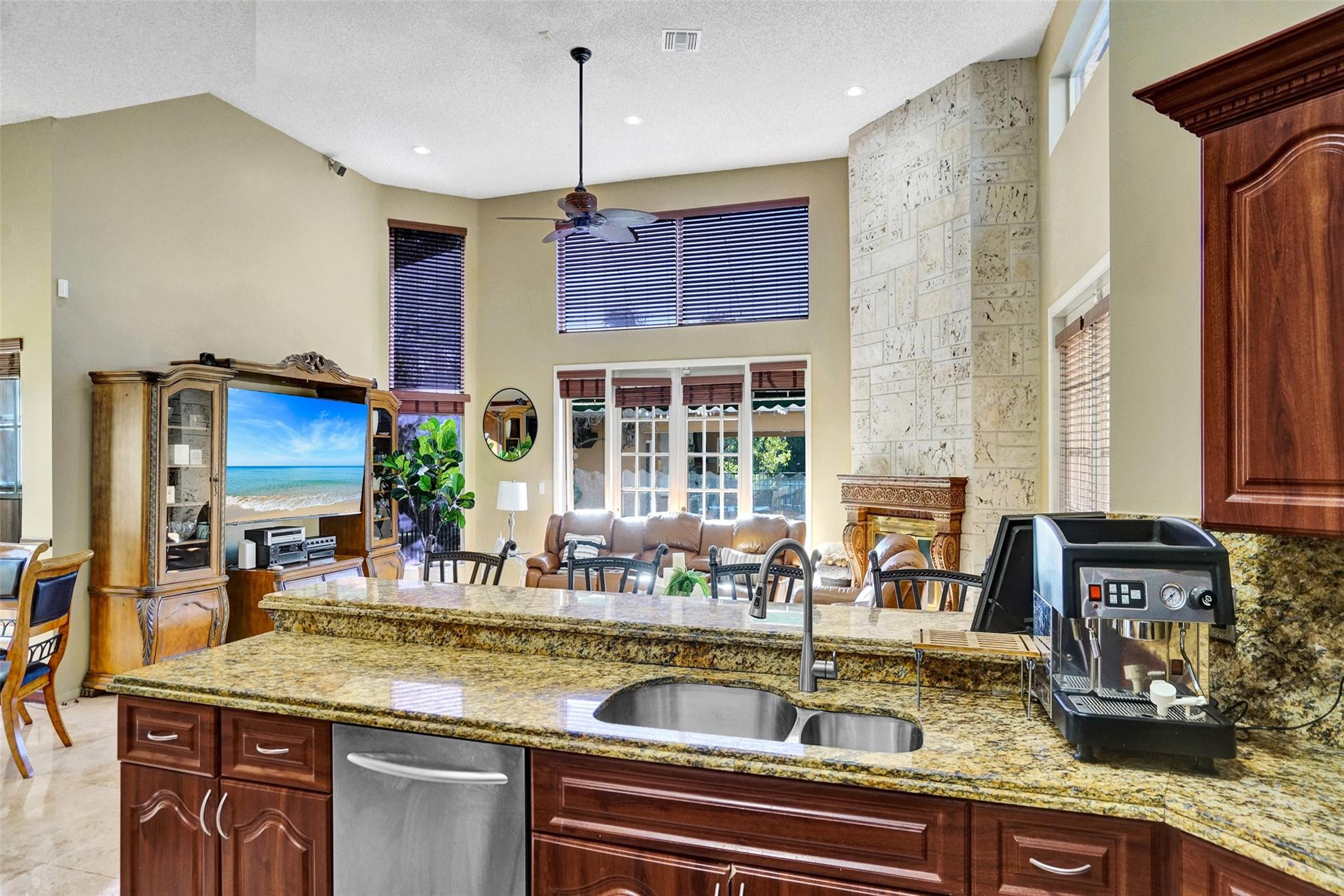 3151 Southwest 135th Terrace Davie, FL 33330 - Photo 19 of 74 a kitchen with sink refrigerator and window