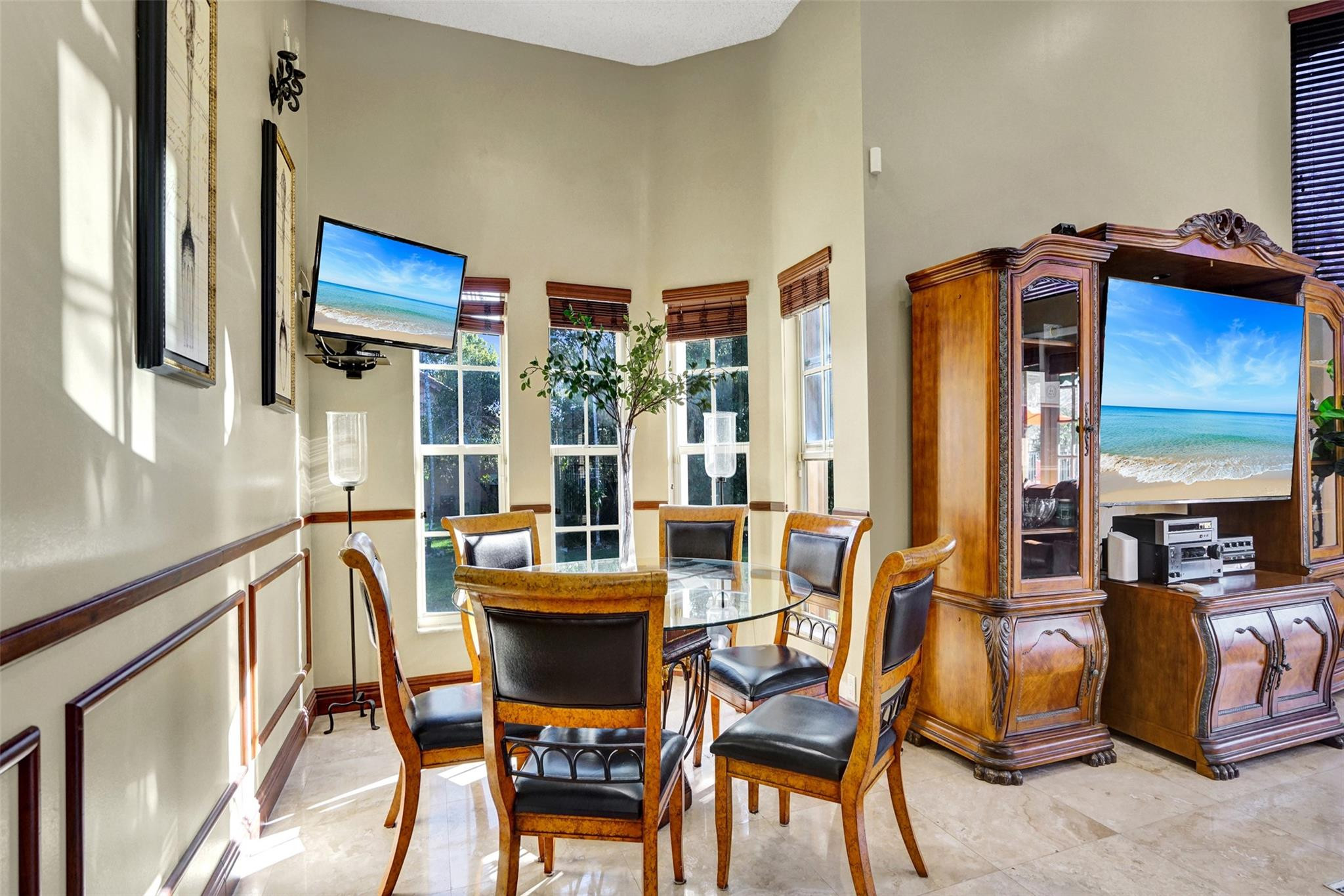 3151 Southwest 135th Terrace Davie, FL 33330 - Photo 22 of 74 a view of a dining room with furniture and a potted plant