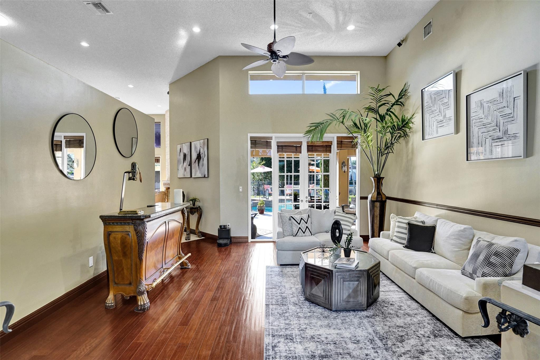 3151 Southwest 135th Terrace Davie, FL 33330 - Photo 29 of 74 a living room with furniture and a chandelier