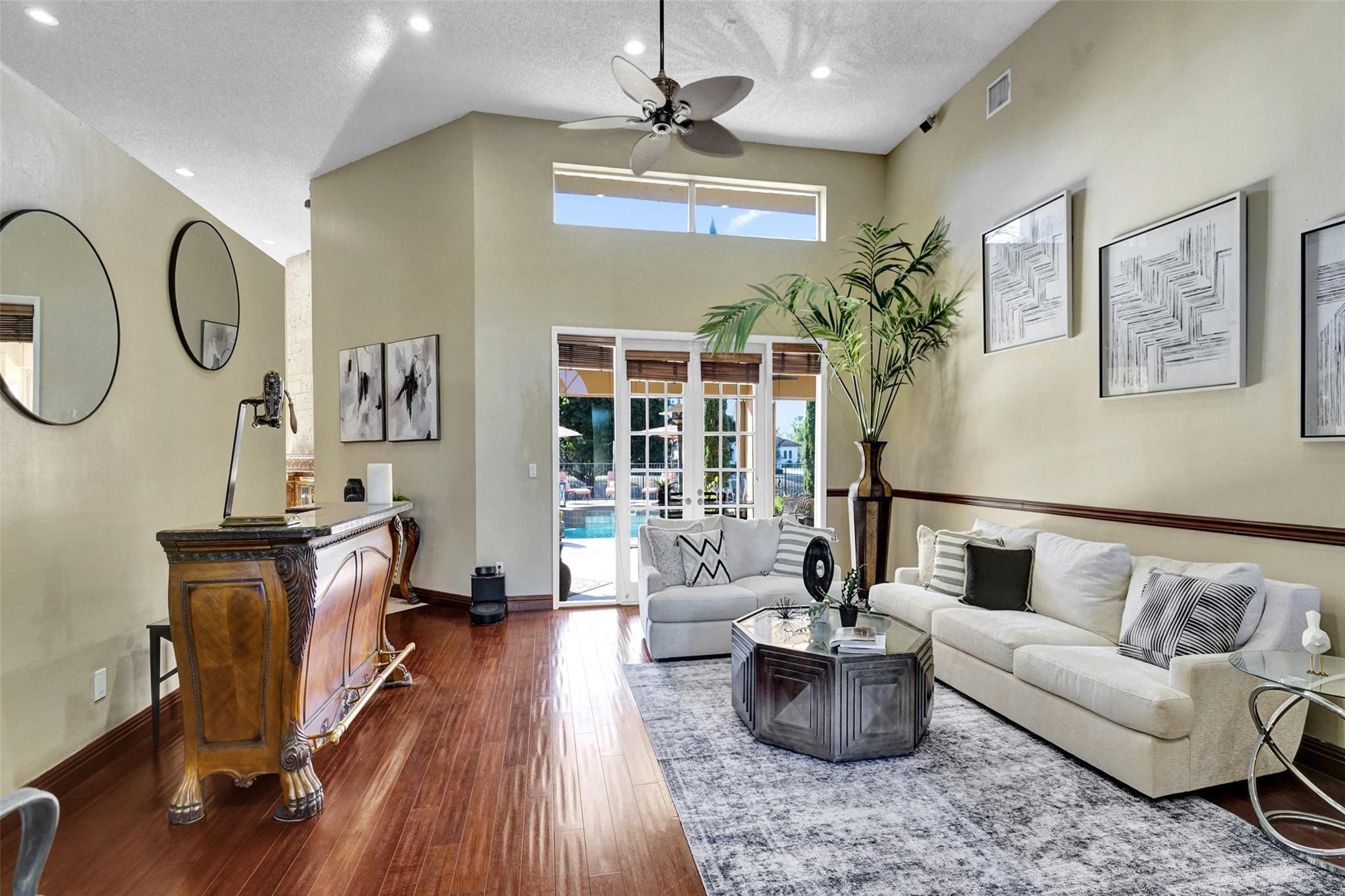 3151 Southwest 135th Terrace Davie, FL 33330 - Photo 30 of 74 a living room with furniture a chandelier and wooden floor