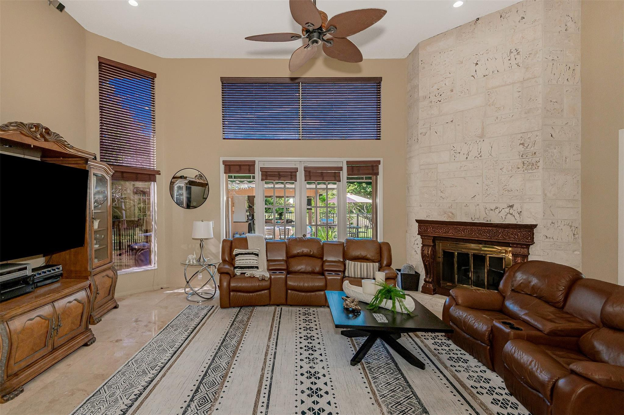 3151 Southwest 135th Terrace Davie, FL 33330 - Photo 36 of 74 a living room with furniture and a fireplace