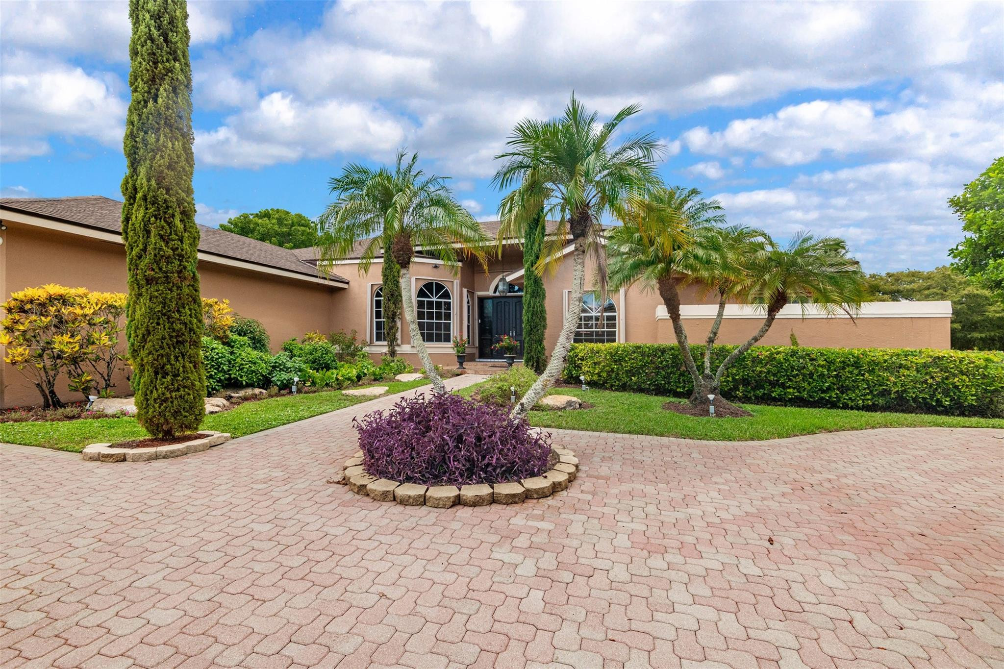 3151 Southwest 135th Terrace Davie, FL 33330 - Photo 4 of 74 a front view of a house with garden