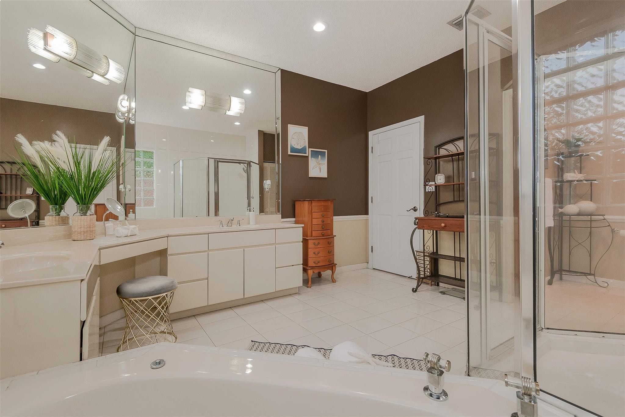 3151 Southwest 135th Terrace Davie, FL 33330 - Photo 41 of 74 a bathroom with a sink a mirror and a shower