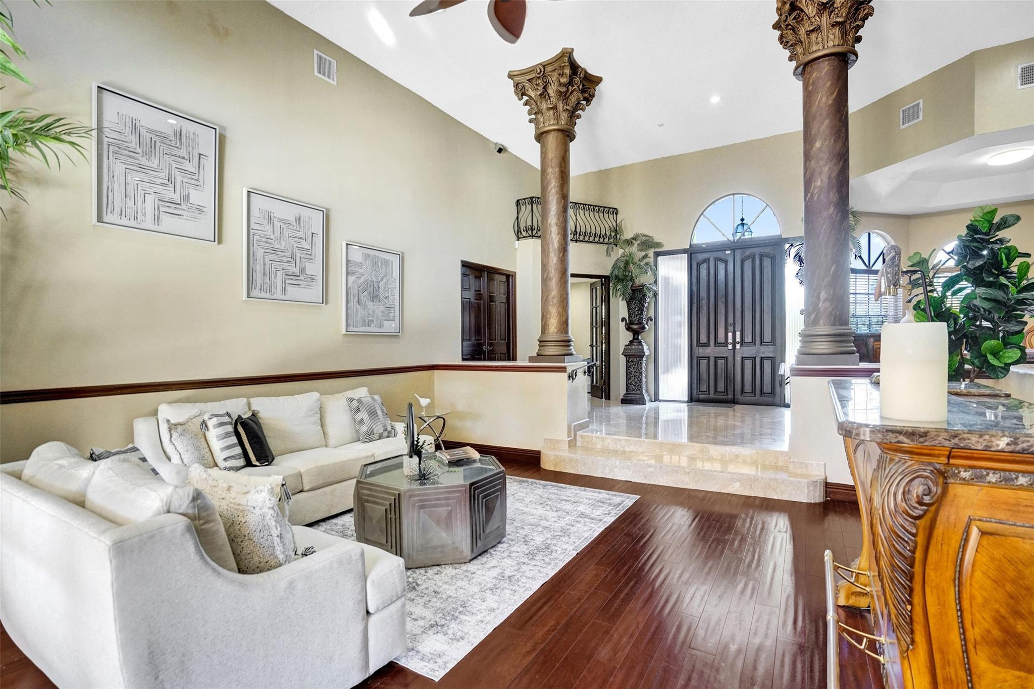 3151 Southwest 135th Terrace Davie, FL 33330 - Photo 5 of 74 a living room with furniture and a chandelier