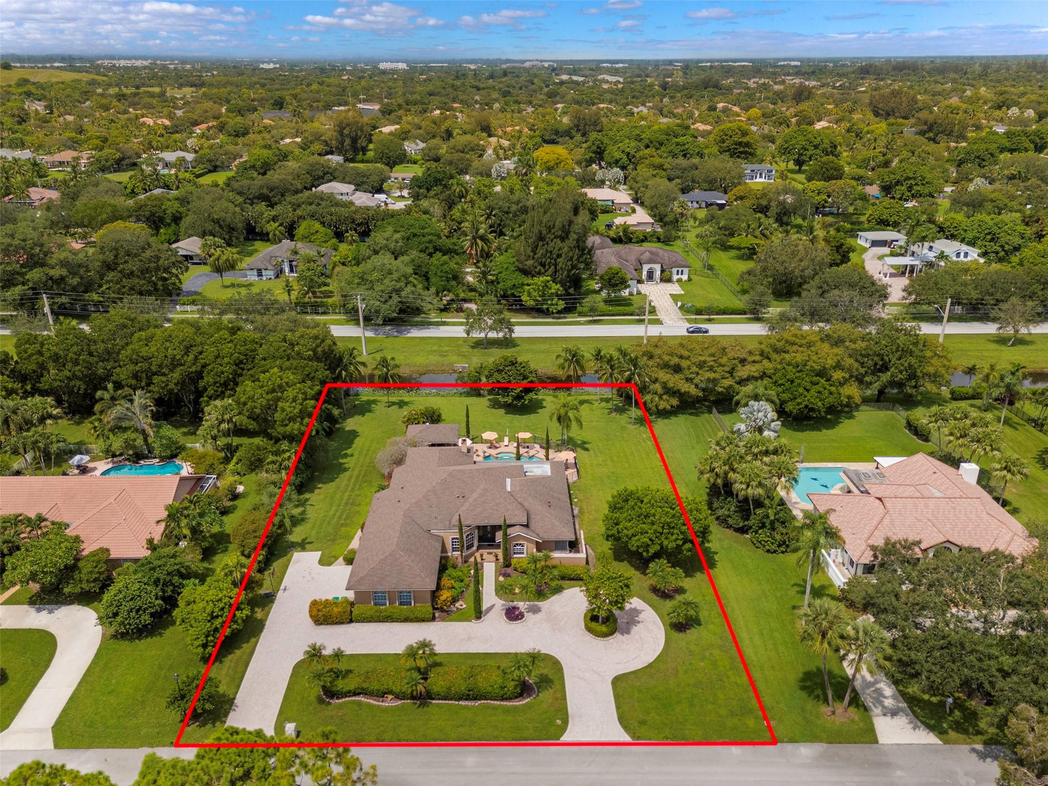 3151 Southwest 135th Terrace Davie, FL 33330 - Photo 60 of 74 an aerial view of residential houses with outdoor space