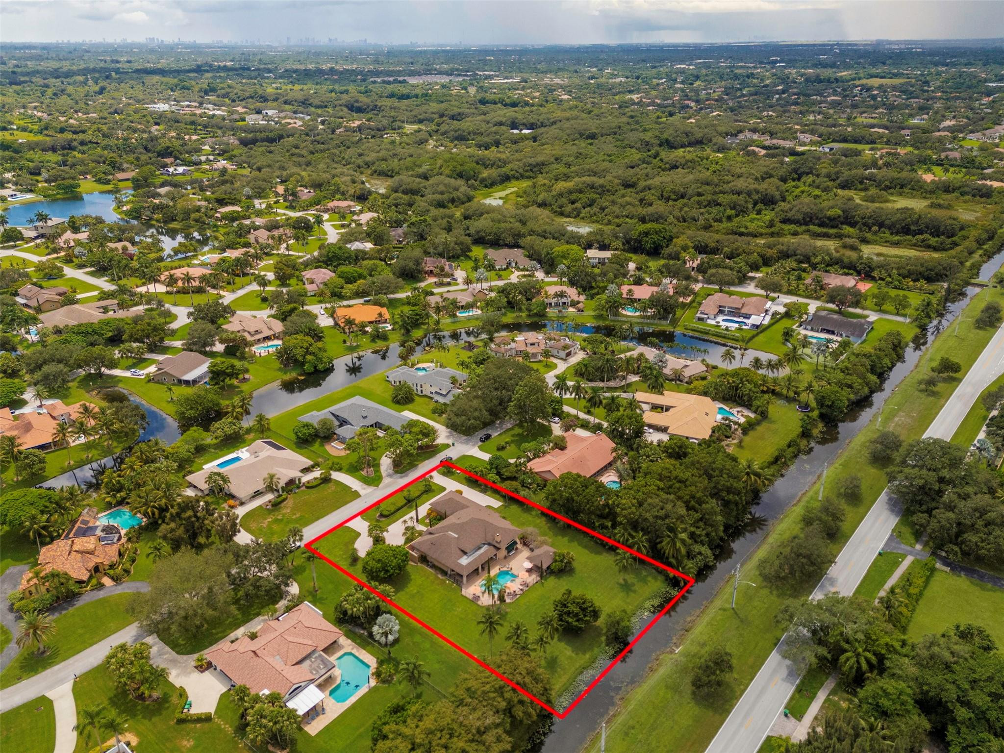 3151 Southwest 135th Terrace Davie, FL 33330 - Photo 62 of 74 an aerial view of residential houses with outdoor space