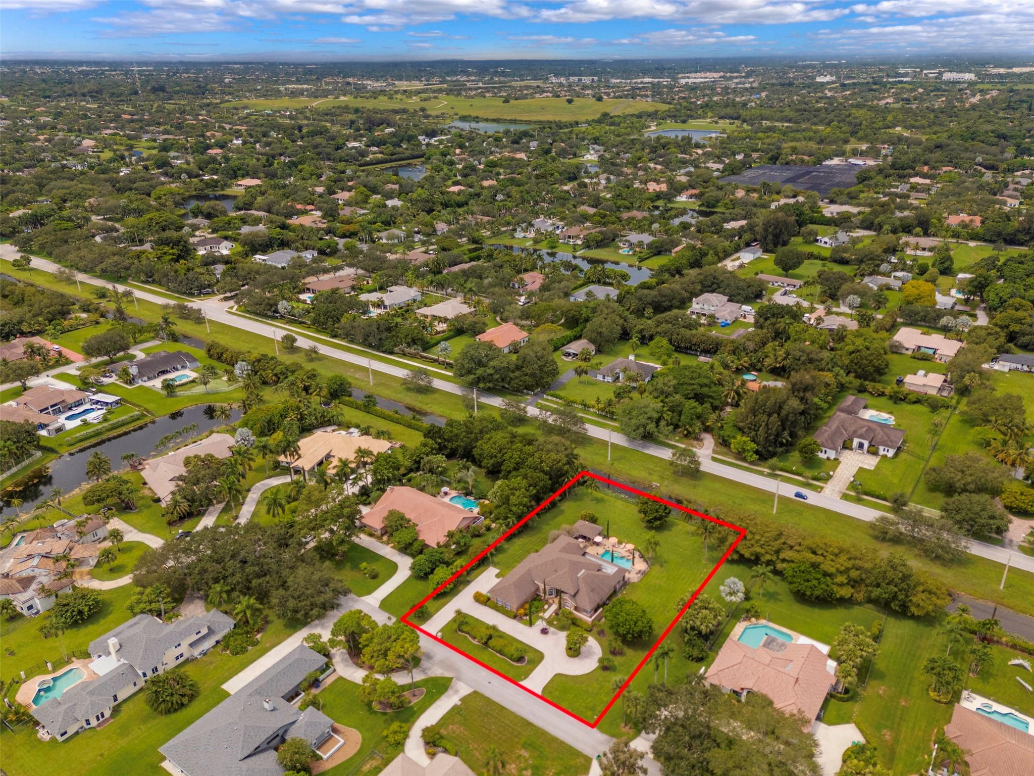3151 Southwest 135th Terrace Davie, FL 33330 - Photo 63 of 74 an aerial view of residential houses with outdoor space