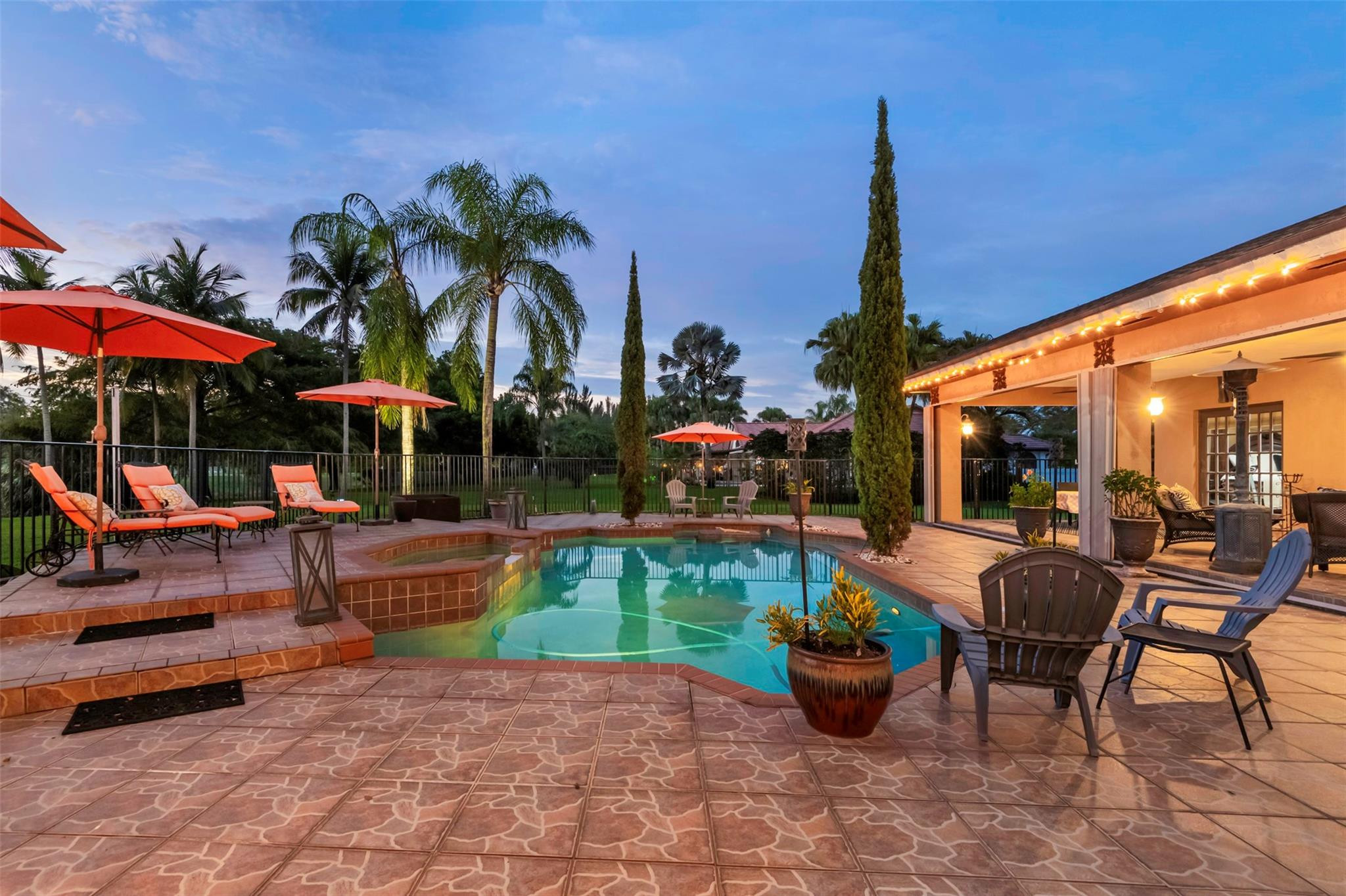 3151 Southwest 135th Terrace Davie, FL 33330 - Photo 69 of 74 a view of a patio with chairs and a fountain
