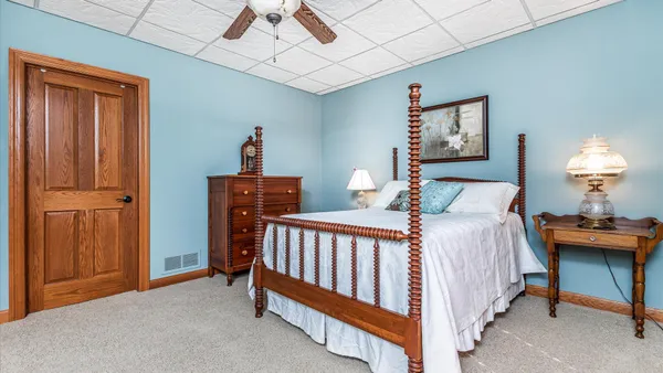 a bed room with a bed and a window