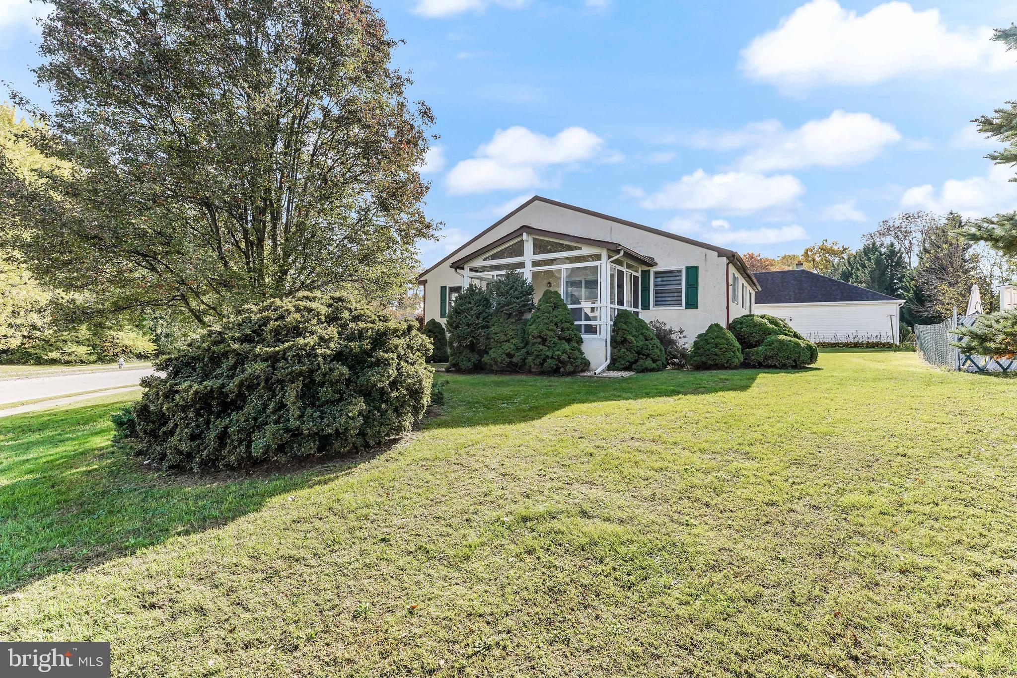 140 Cherry Lane Folsom, PA 19033 - Photo 7 of 35 Side yard showing extra living in 3 season room