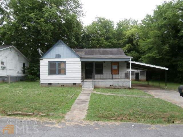 624 Brown Street Southwest Rome, GA 30161 - Photo 1 of 1 a front view of a house with a yard and porch
