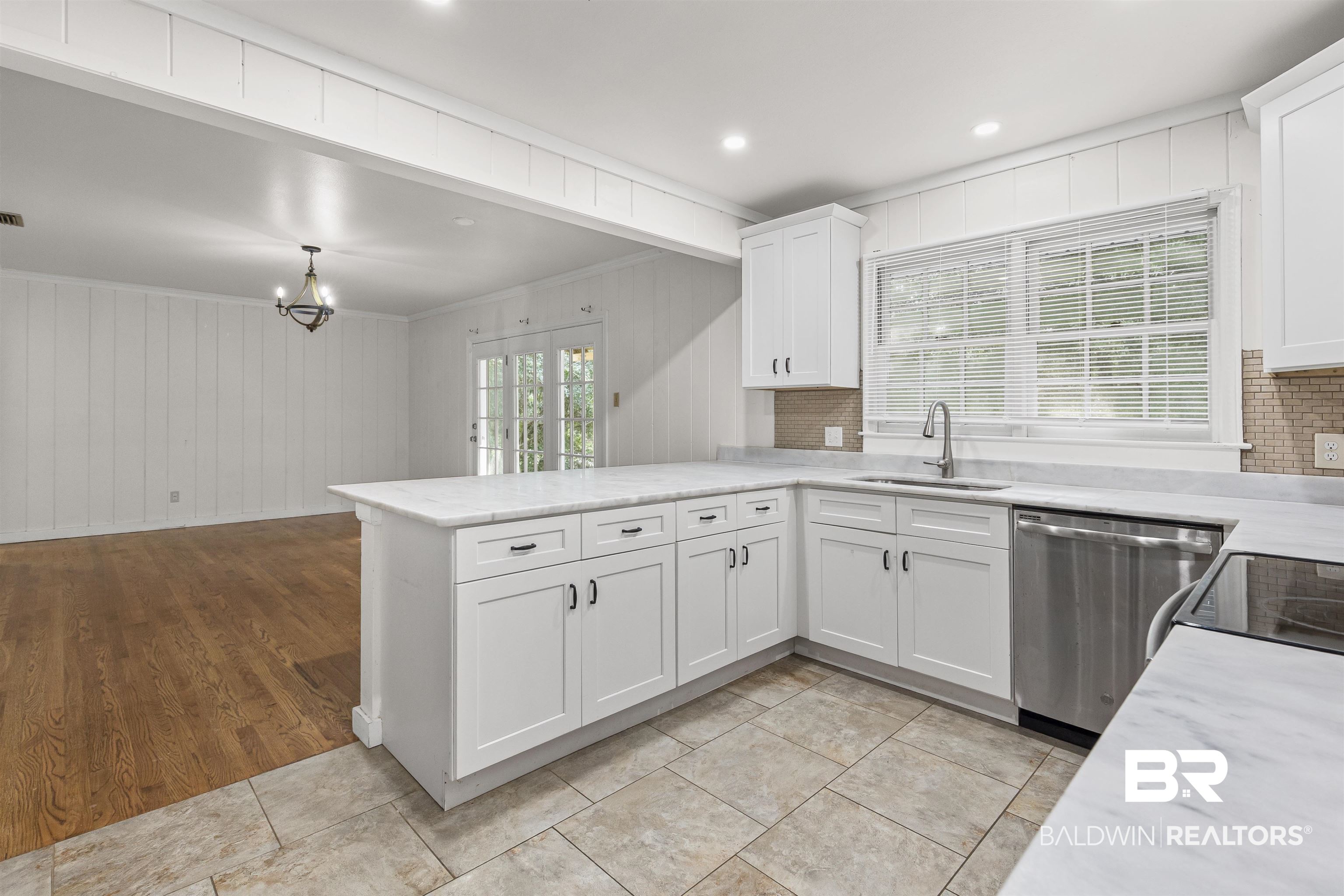 1108 Locarno Street Mobile, AL 36608 - Photo 21 of 24 Kitchen featuring a peninsula, dishwasher, white cabinetry, electric stove, and light stone counters