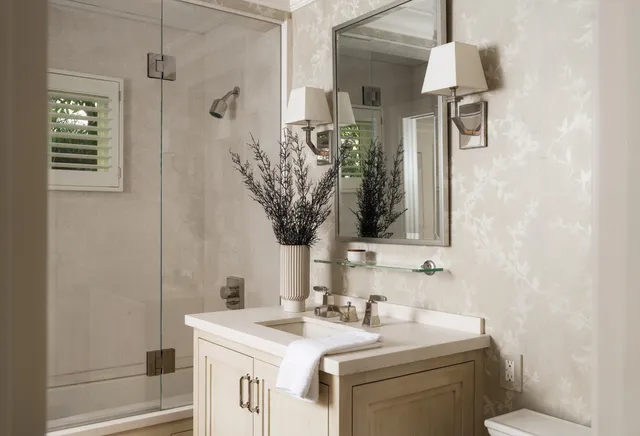a bathroom with a sink a vanity and a mirror