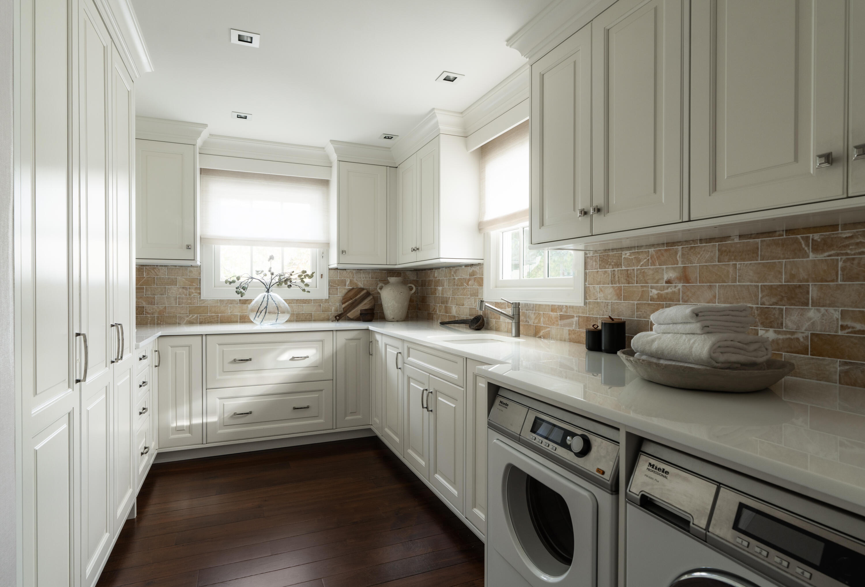 610 Olive Road Montecito, CA 93108 - Photo 21 of 34 a kitchen that has a lot of cabinets in it and wooden floors