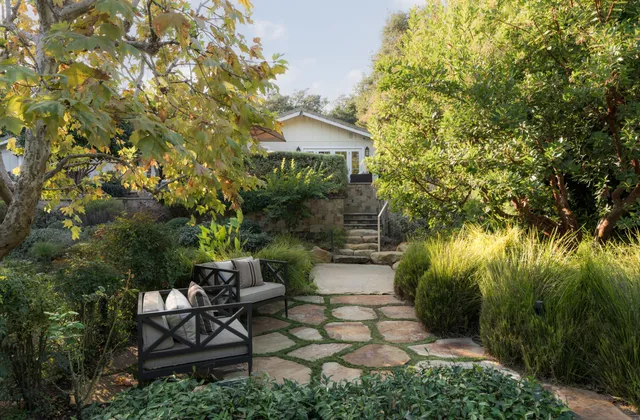 a view of a backyard with sitting area