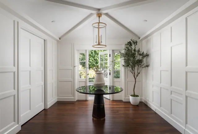 a view of a entryway in a hall with a window