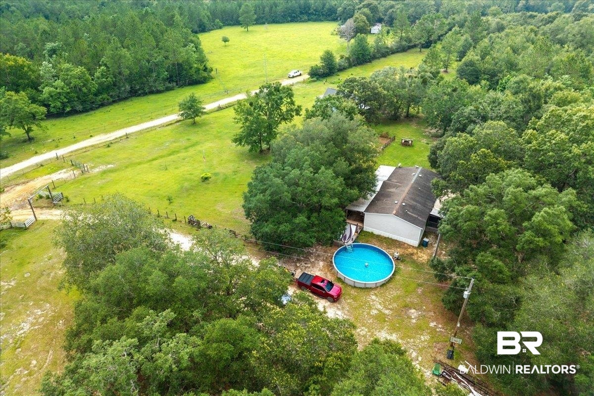 21011 River Road Robertsdale, AL 36567 - Photo 24 of 29 Single-story residence set on an expansive lot surrounded by mature trees and natural landscaping