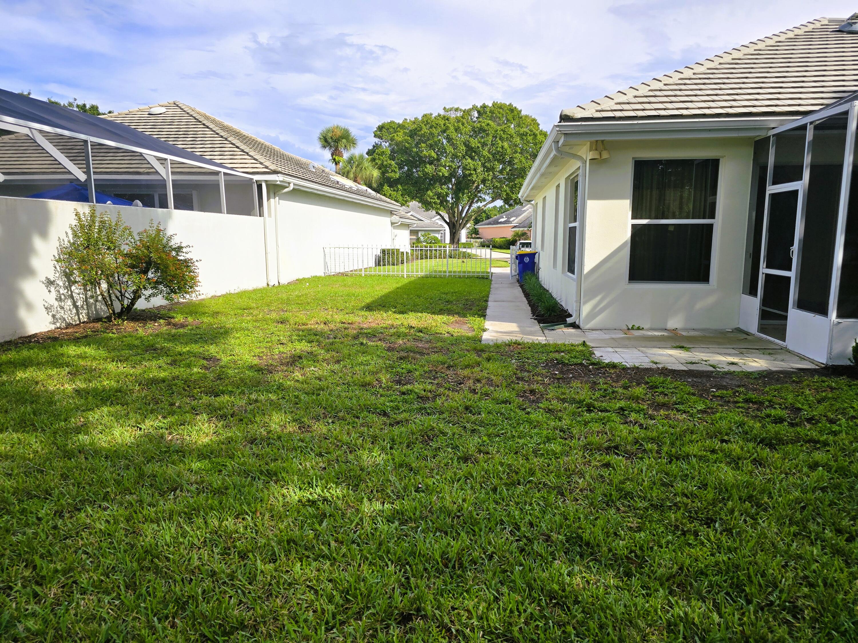 5131 Southeast Sweetbrier Terrace Hobe Sound, FL 33455 - Photo 15 of 18 a view of a house with backyard