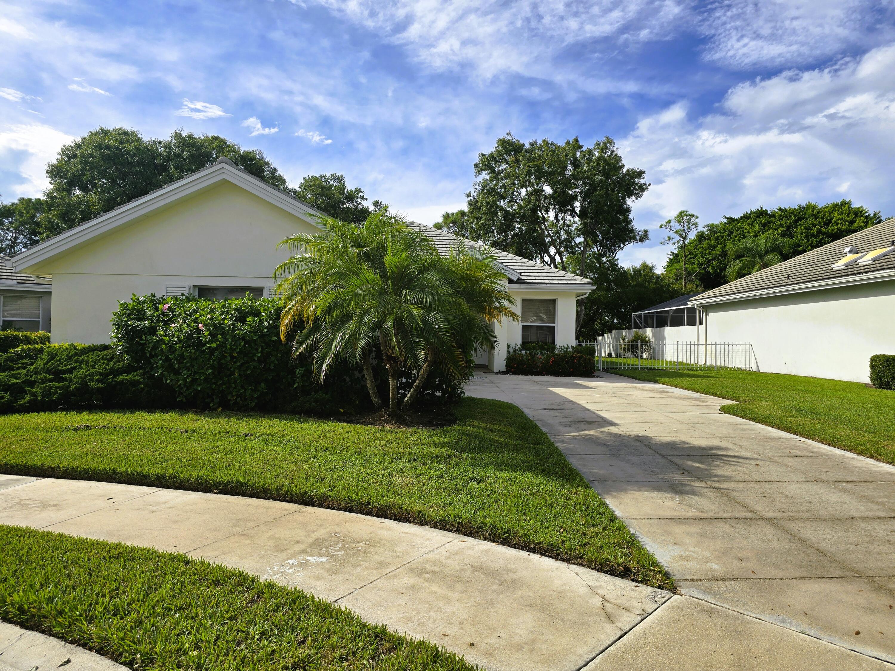 5131 Southeast Sweetbrier Terrace Hobe Sound, FL 33455 - Photo 18 of 18 a house view with a garden space