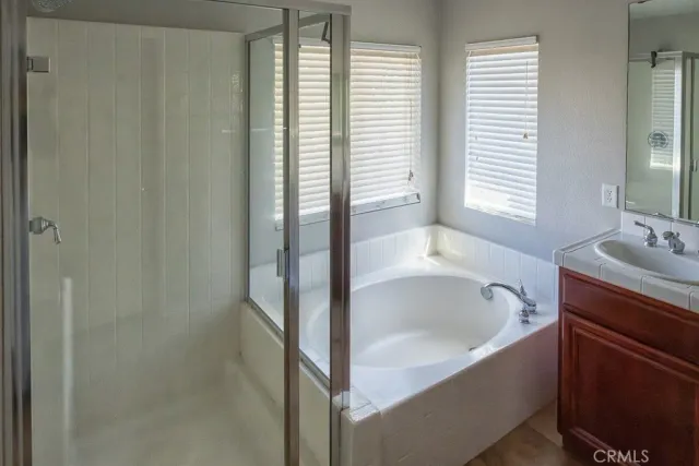 a bathroom with a bathtub and window