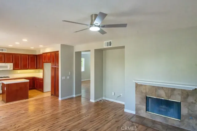 a view of a kitchen with a sink and a fireplace