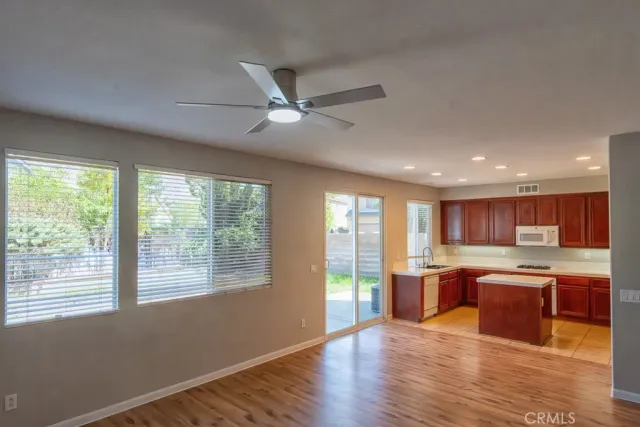 a view of kitchen with wooden floor and window
