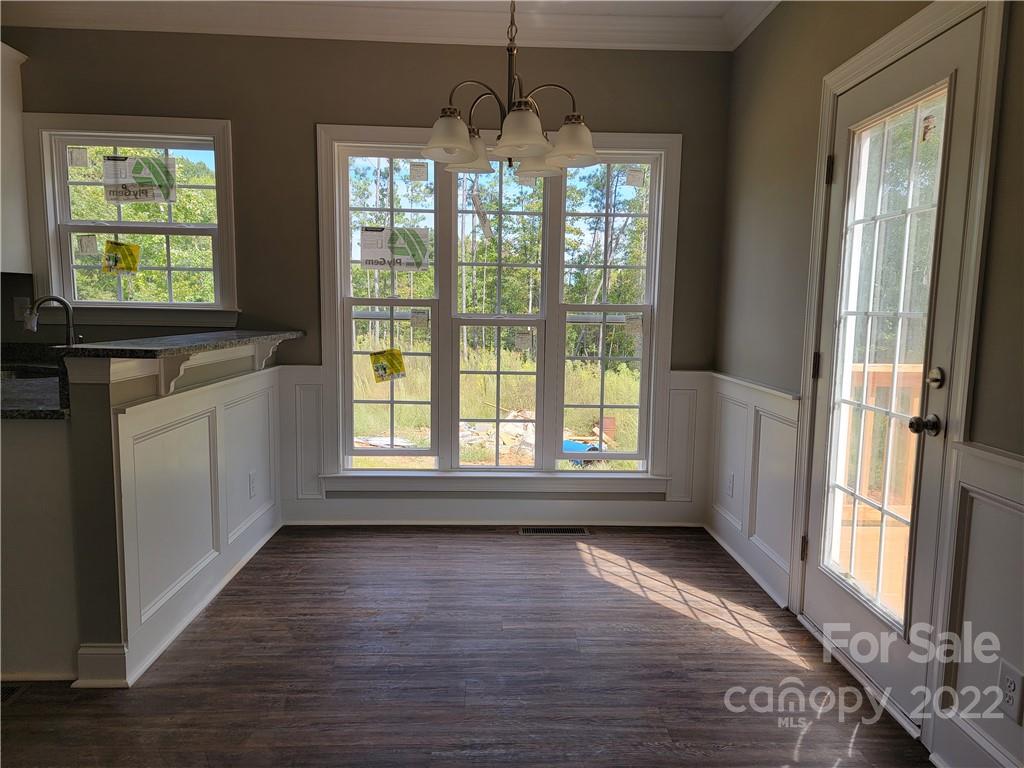 970 Miles Road Dallas, NC 28034 - Photo 9 of 15 a view of an empty room with wooden floor and a window