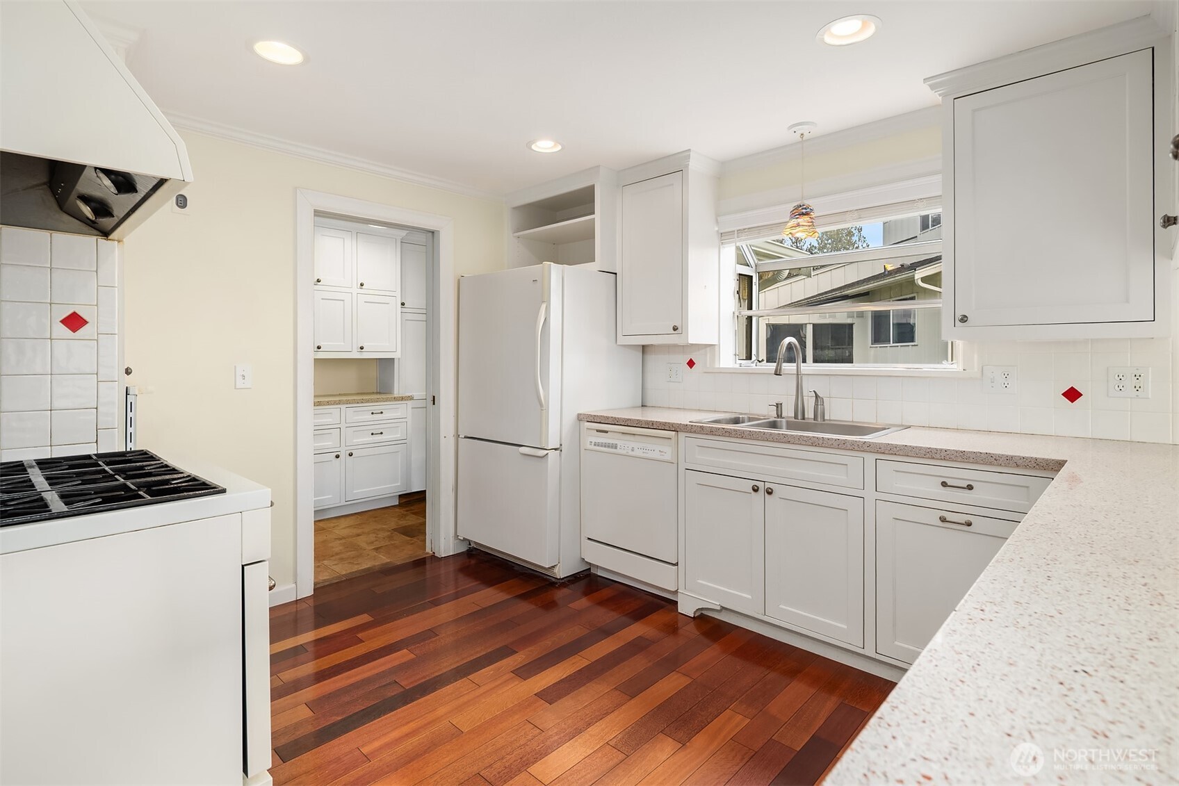 103 West Rivmont Drive Monroe, WA 98272 - Photo 11 of 34 a kitchen with cabinets and wooden floor