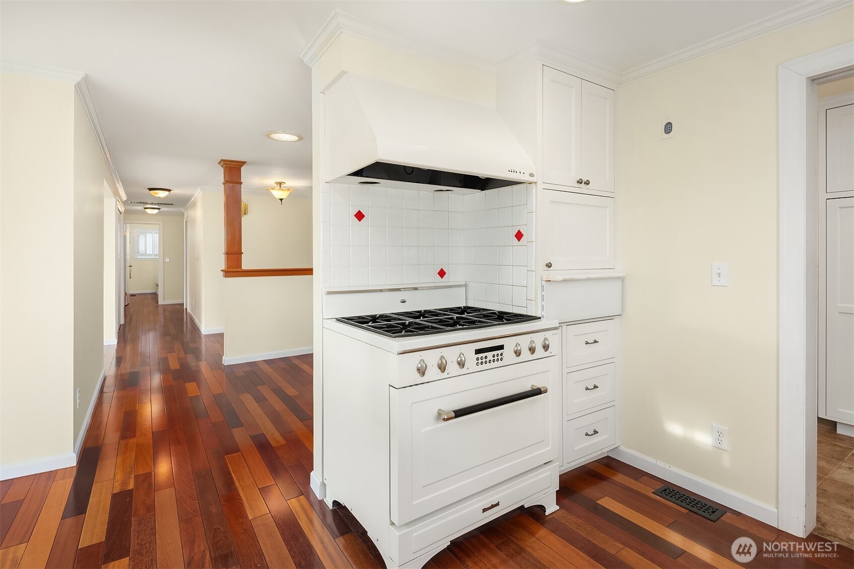 103 West Rivmont Drive Monroe, WA 98272 - Photo 12 of 34 a kitchen with a stove and a wooden floor