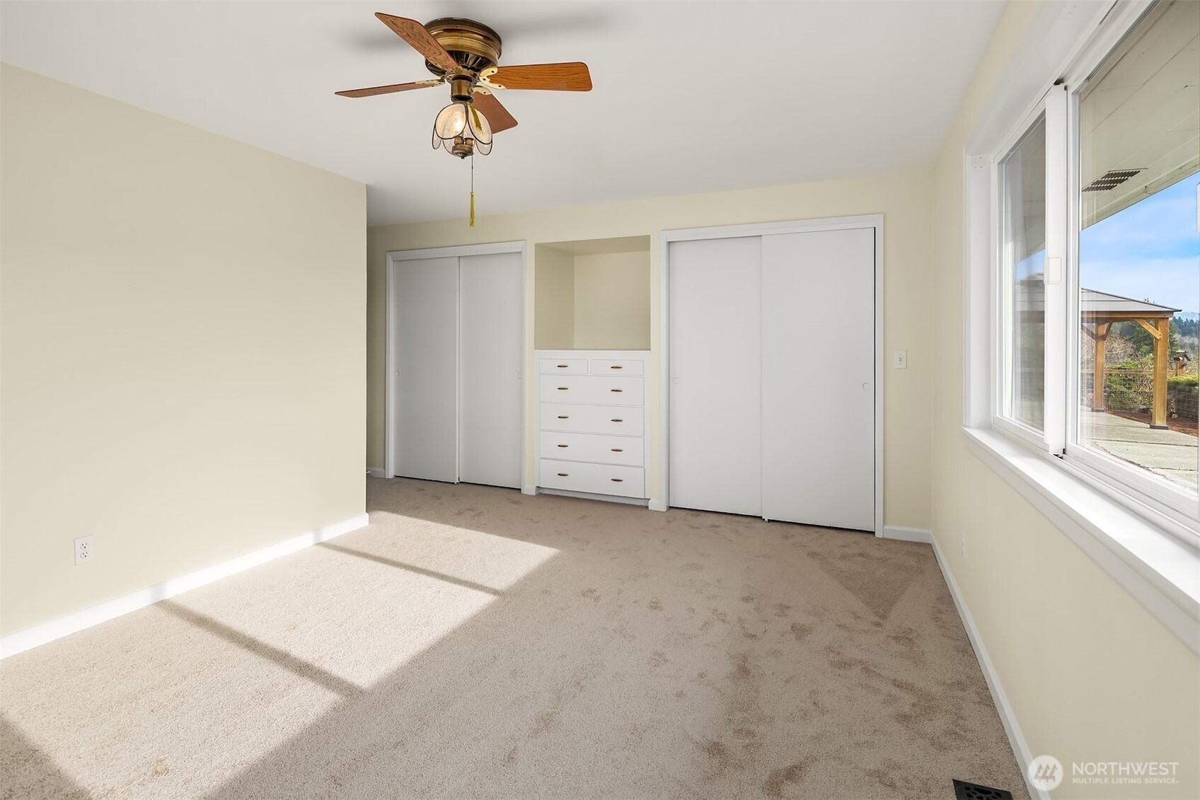 103 West Rivmont Drive Monroe, WA 98272 - Photo 18 of 34 a view of a room with cabinet with a ceiling fan