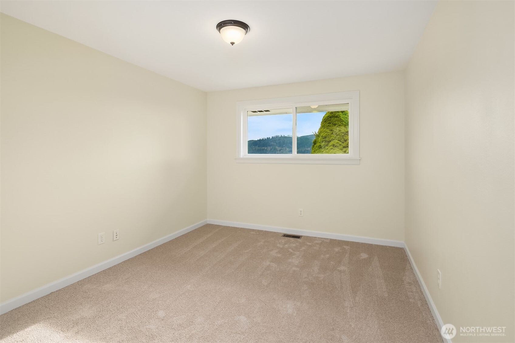 103 West Rivmont Drive Monroe, WA 98272 - Photo 21 of 34 an empty room with windows