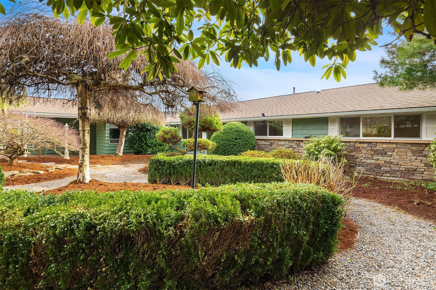 103 West Rivmont Drive Monroe, WA 98272 - Photo 26 of 34 a front view of a house with garden