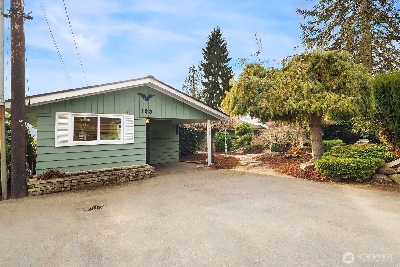 103 West Rivmont Drive Monroe, WA 98272 - Photo 27 of 34 a view of a house with a yard and garage