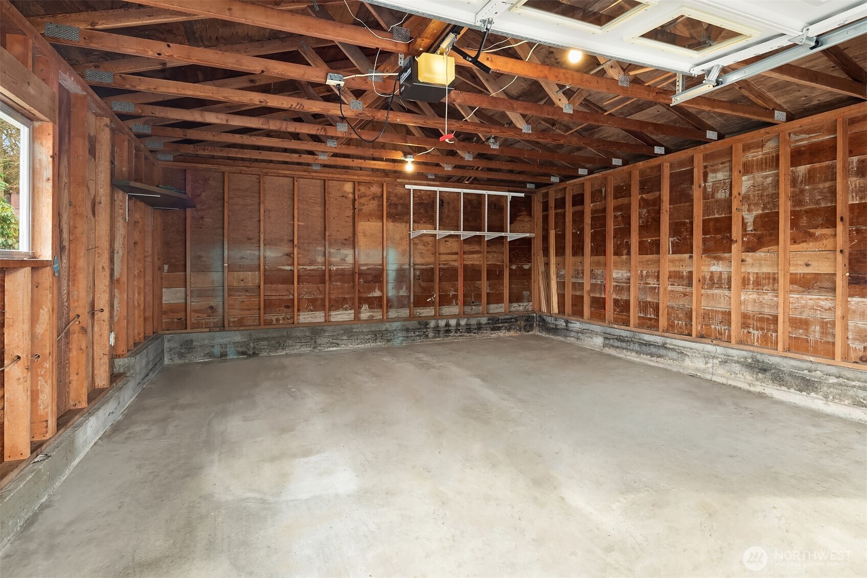 103 West Rivmont Drive Monroe, WA 98272 - Photo 30 of 34 a view of an empty room with wooden walls