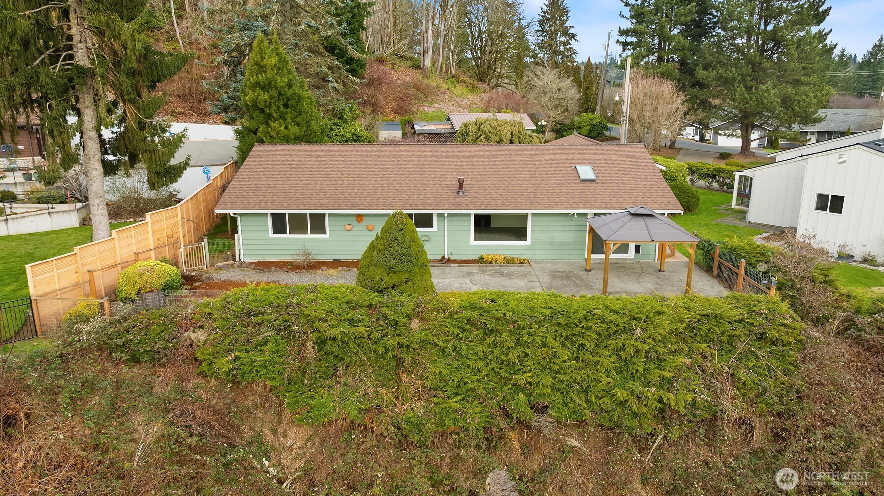 103 West Rivmont Drive Monroe, WA 98272 - Photo 33 of 34 a aerial view of a house with swimming pool and large trees
