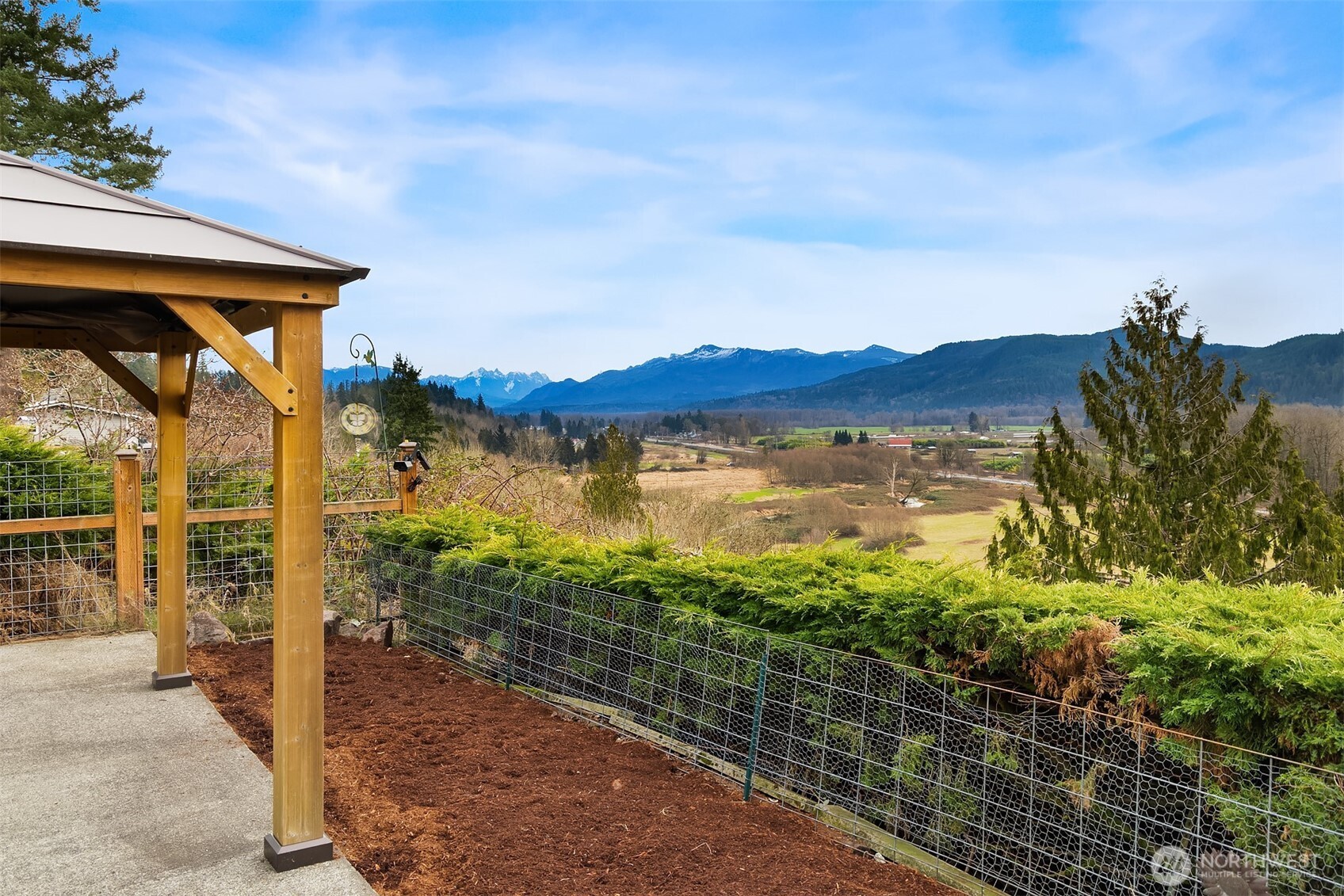 103 West Rivmont Drive Monroe, WA 98272 - Photo 4 of 34 a view of a lake with a mountain in the background