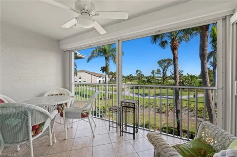 a view of a livingroom with furniture and a window