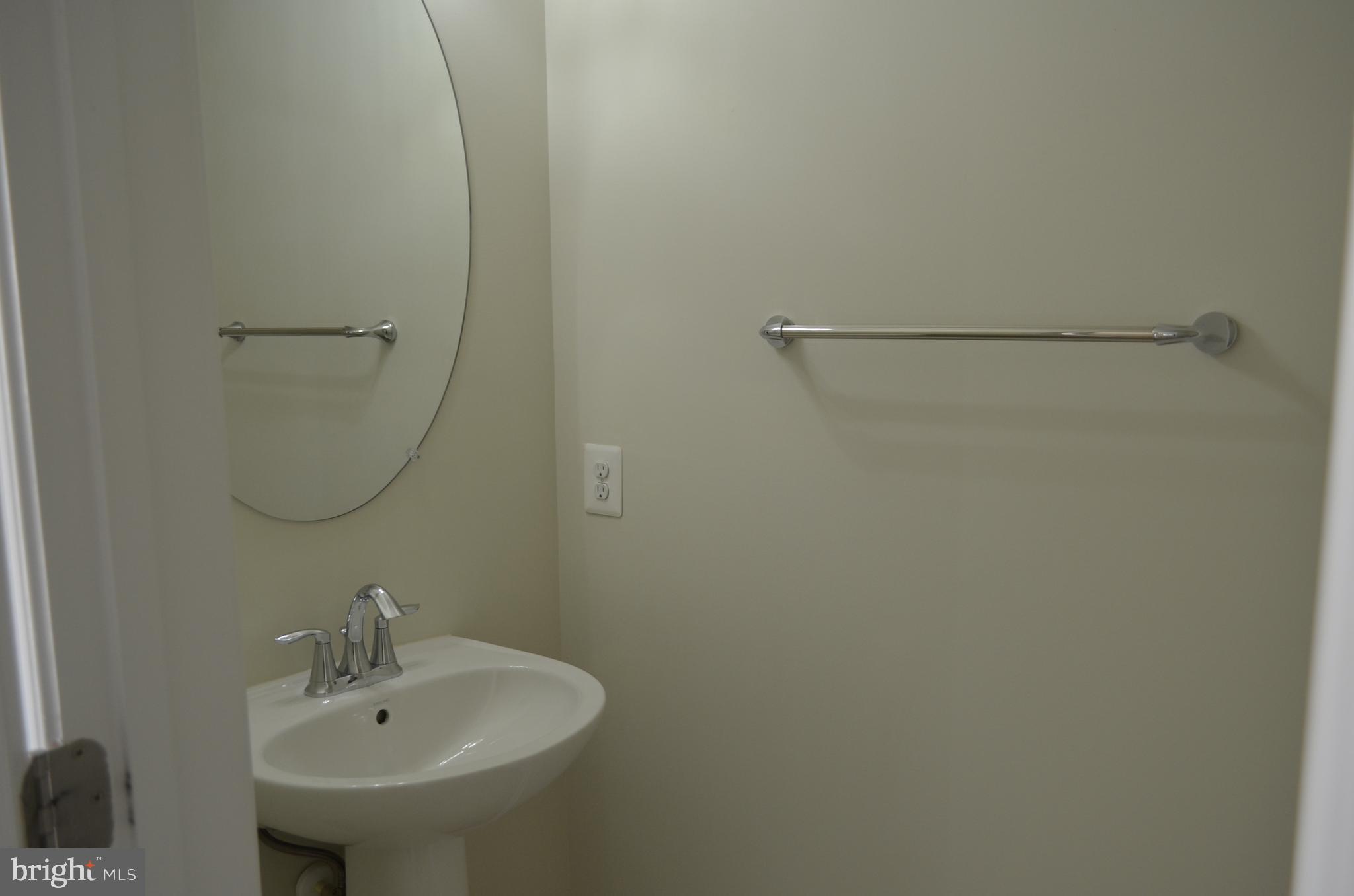 6004 Forum Frederick, MD 21703 - Photo 13 of 30 a bathroom with a sink and a mirror