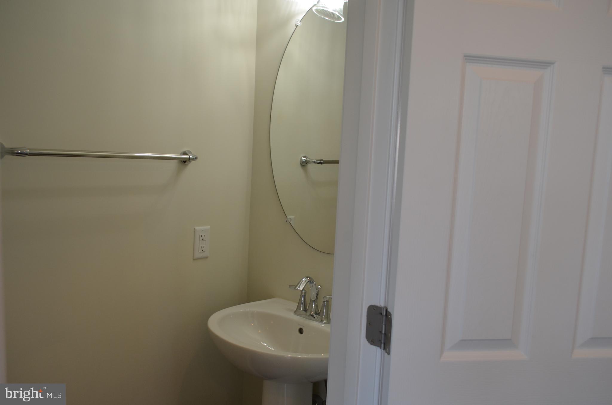 6004 Forum Frederick, MD 21703 - Photo 14 of 30 a bathroom with a sink and shower
