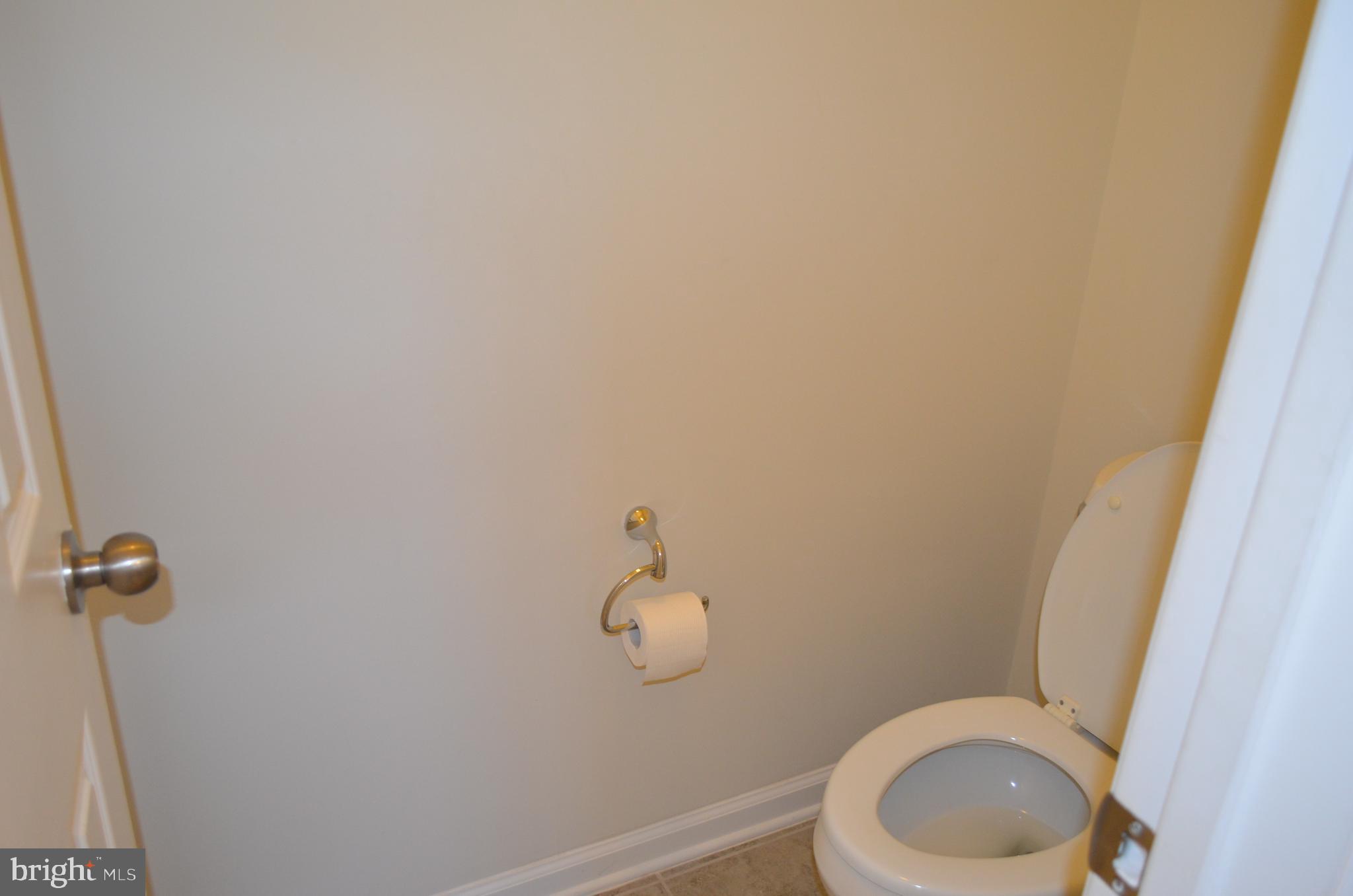 6004 Forum Frederick, MD 21703 - Photo 18 of 30 a bathroom with a toilet and a sink