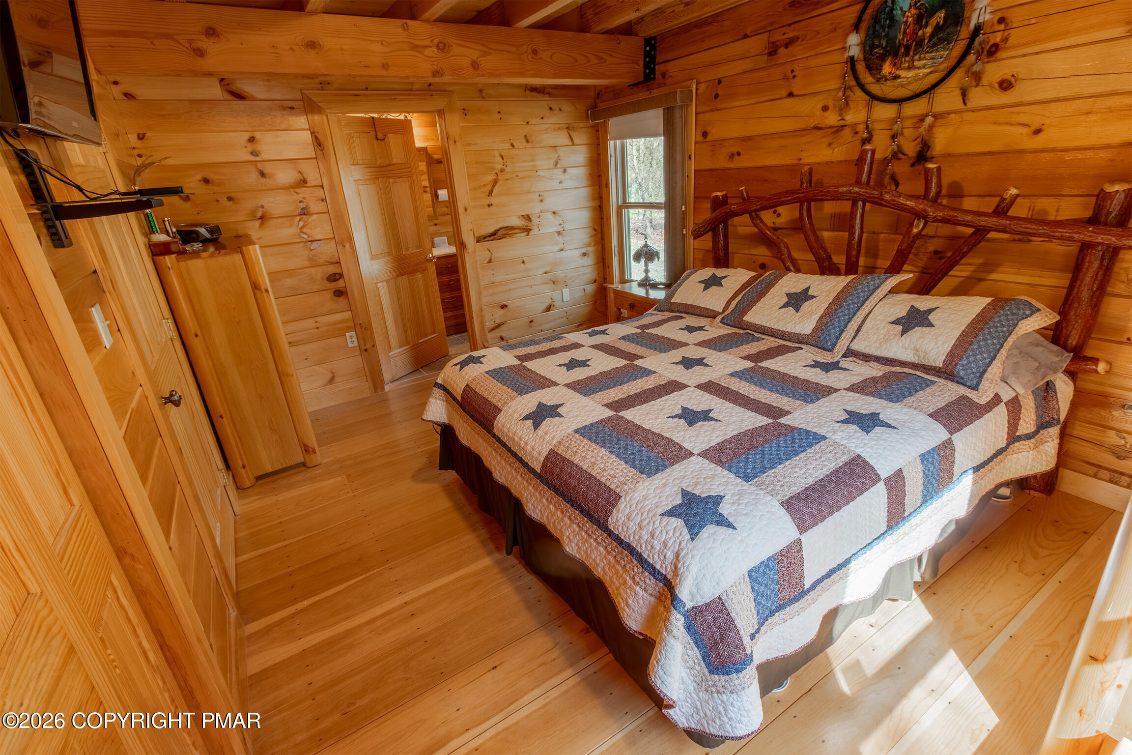 1160 Bluebird Lane Bushkill, PA 18324 - Photo 27 of 44 a bed sitting in a bedroom next to a window