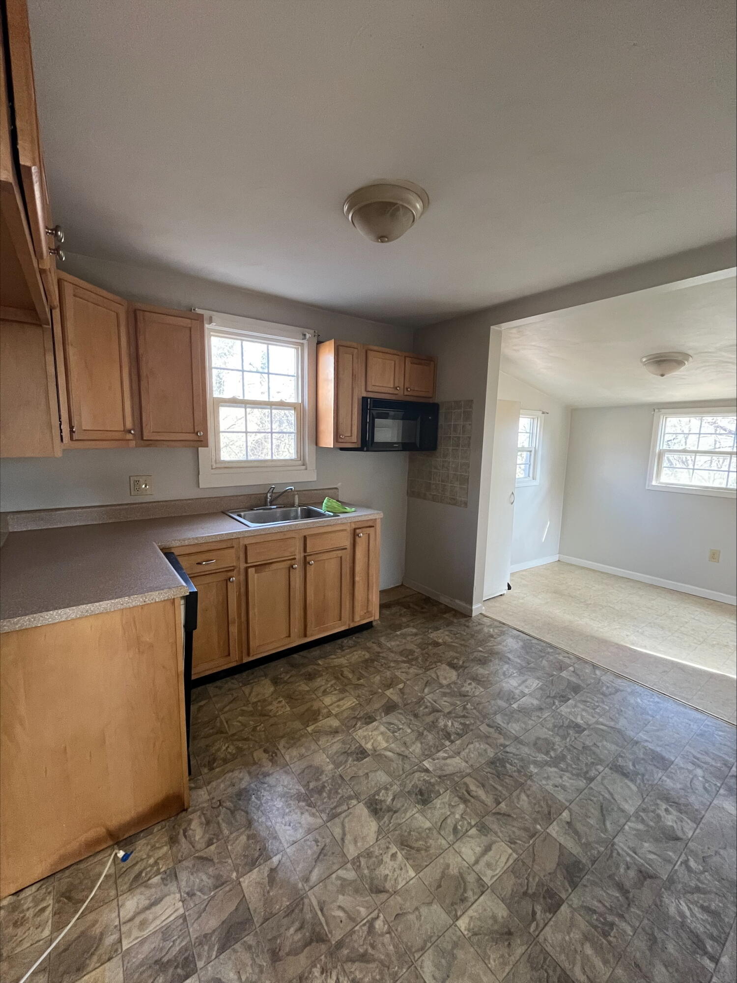 4529 Old Mountain Road Northeast Roanoke, VA 24019 - Photo 4 of 18 a view of a kitchen with a sink and dishwasher with a fireplace