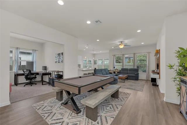a view of a livingroom with furniture and wooden floor