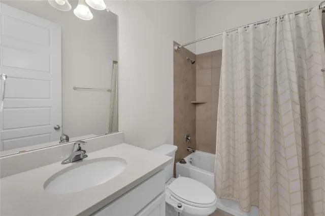 a bedroom with a bed and a lamp