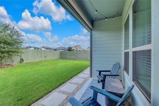 a view of yard with seating area and furniture