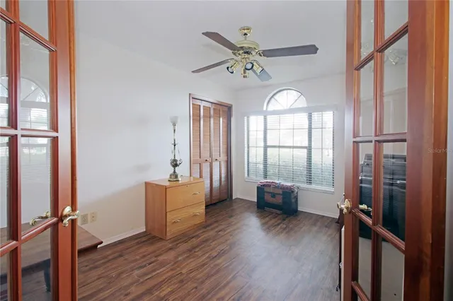 a view of a livingroom with furniture window and wooden floor