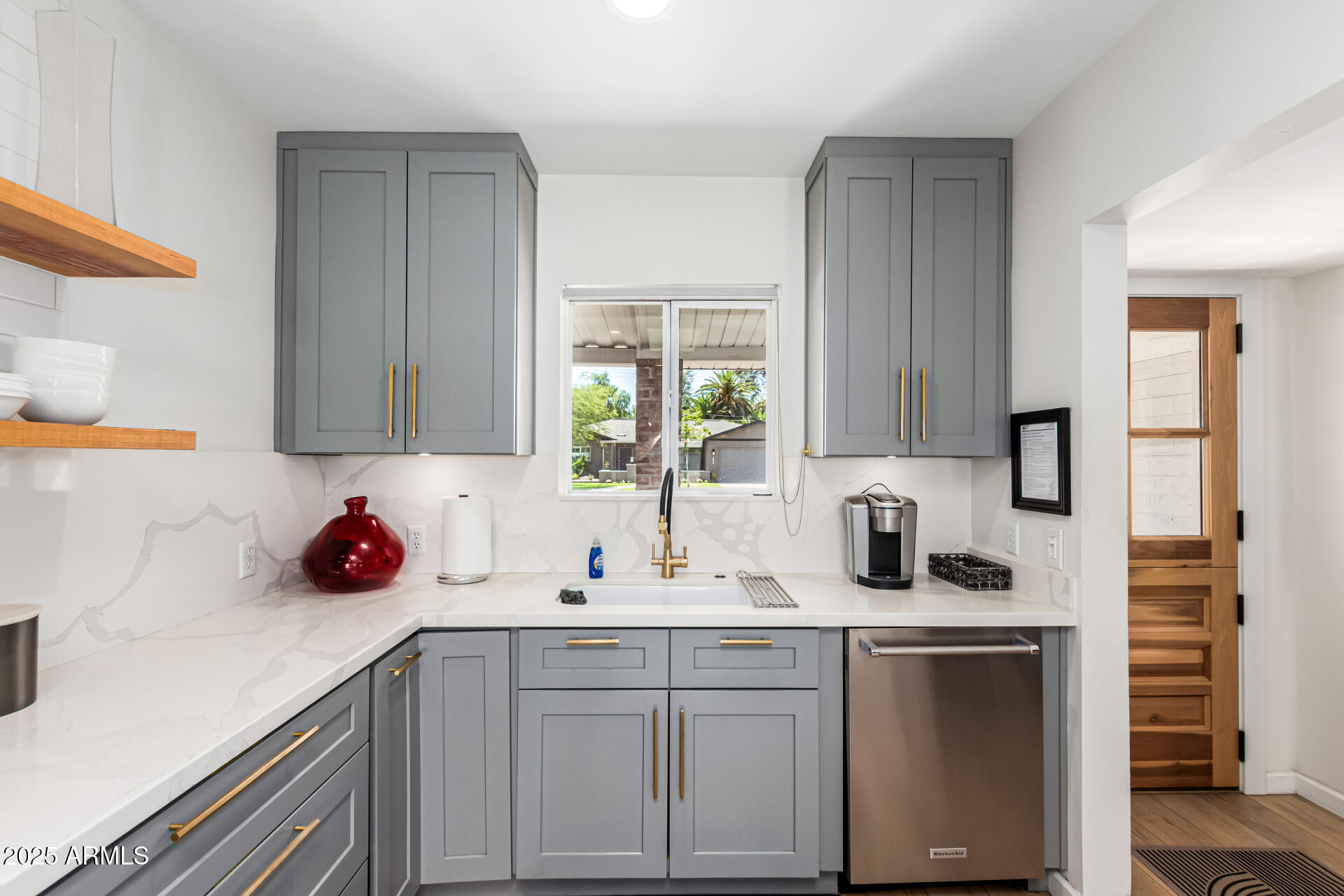 3809 North 35th Street Phoenix, AZ 85018 - Photo 18 of 43 a kitchen with white cabinets and sink