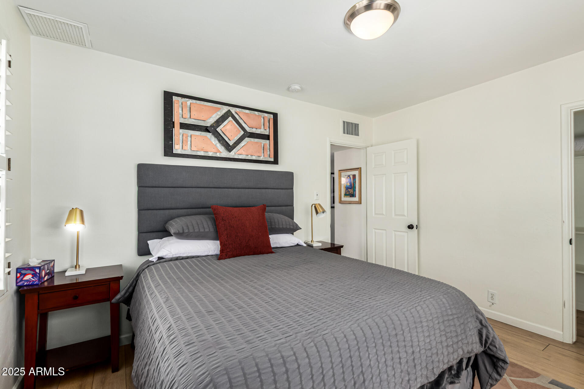 3809 North 35th Street Phoenix, AZ 85018 - Photo 27 of 43 a bedroom with a bed and a window