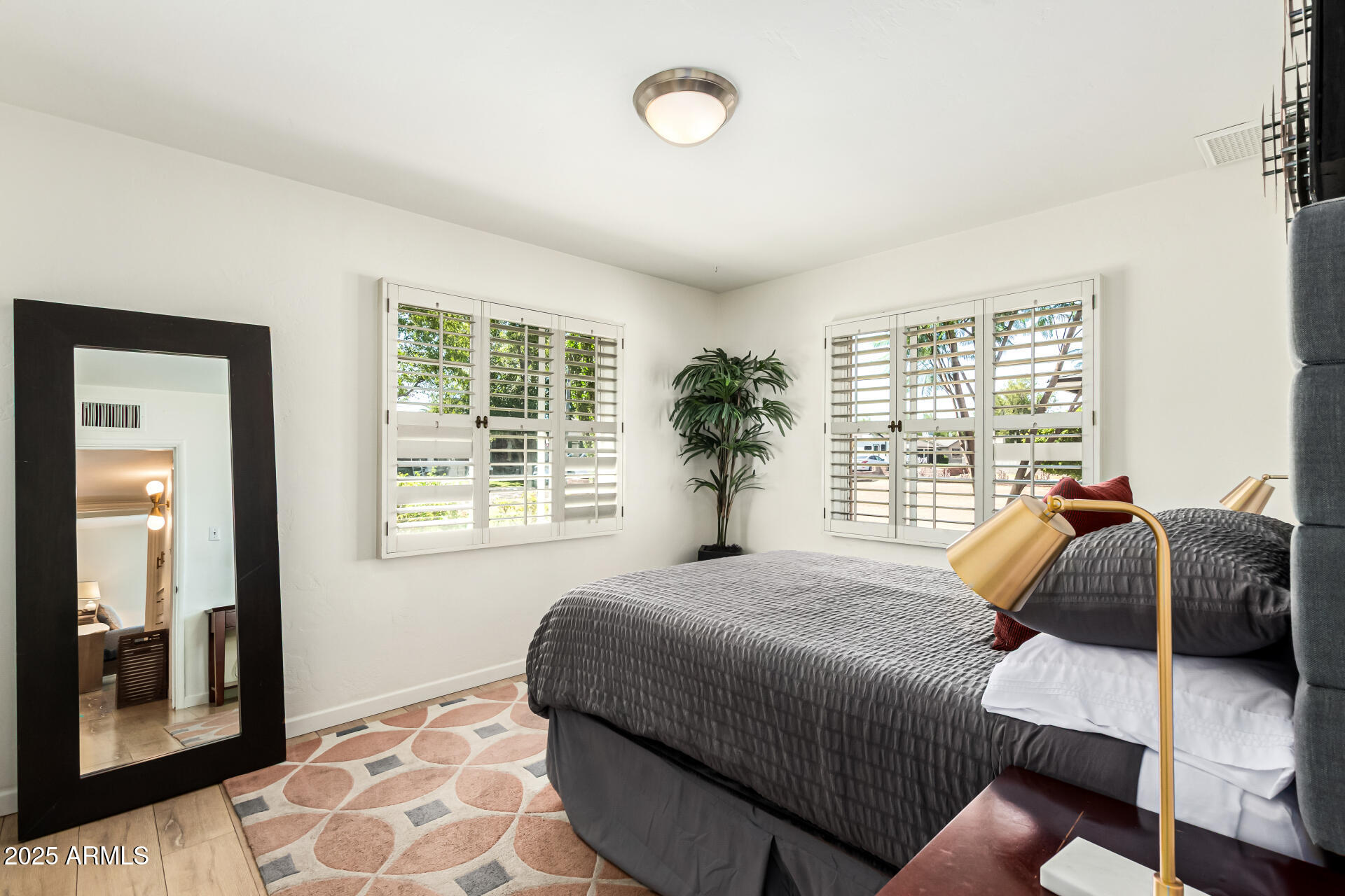 3809 North 35th Street Phoenix, AZ 85018 - Photo 28 of 43 a bedroom with a bed and a window